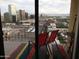 Balcony with red seating and cityscape views at 207 W Clarendon Ave # G18, Phoenix, AZ 85013