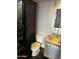 Modern bathroom featuring tiled shower, glass sink, and sleek fixtures at 207 W Clarendon Ave # G18, Phoenix, AZ 85013