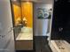 Bathroom with modern fixtures, elegant vanity, and sleek black and gray tile at 207 W Clarendon Ave # G18, Phoenix, AZ 85013