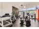 Well-equipped gym with modern exercise machines and natural light at 207 W Clarendon Ave # G18, Phoenix, AZ 85013