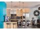 Modern kitchen with stainless steel appliances, sleek countertops, and bar seating at 207 W Clarendon Ave # G18, Phoenix, AZ 85013