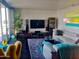 Living room featuring floor to ceiling windows, comfortable seating, and a view of the city at 207 W Clarendon Ave # G18, Phoenix, AZ 85013
