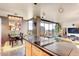 Bright living space featuring city views, modern lighting, and a sleek kitchen with stainless steel appliances at 207 W Clarendon Ave # G18, Phoenix, AZ 85013