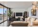 This living room offers city views, tile floors, and sleek modern decor for comfortable living at 207 W Clarendon Ave # G18, Phoenix, AZ 85013