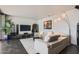 Bright living room with tile floors, modern lighting, and comfortable seating creating a cozy atmosphere at 207 W Clarendon Ave # G18, Phoenix, AZ 85013