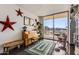 Cozy living room with piano and city views at 207 W Clarendon Ave # G18, Phoenix, AZ 85013