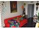 Eclectic living room with bold colors, patterned wallpaper, unique art, and cozy seating at 207 W Clarendon Ave # G18, Phoenix, AZ 85013