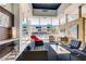 Bright lobby with stylish furniture and large windows overlooking the outdoor pool at 207 W Clarendon Ave # G18, Phoenix, AZ 85013