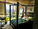Bedroom showcasing a stylish bed, soft rug, city views, and a bright, open ambiance at 207 W Clarendon Ave # G18, Phoenix, AZ 85013