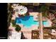 Aerial view of the sparkling community pool, hot tub, lounge area, and manicured landscaping at 207 W Clarendon Ave # G18, Phoenix, AZ 85013