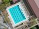 Aerial view of the swimming pool with lounge chairs and surrounding lush community landscape at 20718 W Colter St, Buckeye, AZ 85396