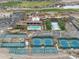 Aerial view showcasing tennis courts, community pool, and recreational facilities within the community at 20718 W Colter St, Buckeye, AZ 85396