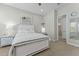 Stylish bedroom with a mirrored bed frame and nightstands is brightly lit at 20718 W Colter St, Buckeye, AZ 85396