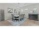 Elegant dining room with stylish chairs, modern art, and a sophisticated bar area at 20718 W Colter St, Buckeye, AZ 85396
