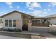 Charming single-story home featuring a well-manicured front yard and inviting curb appeal at 20718 W Colter St, Buckeye, AZ 85396