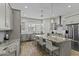 Gourmet kitchen featuring a large island, granite countertops, stainless steel appliances at 20718 W Colter St, Buckeye, AZ 85396