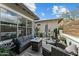 Relaxing outdoor patio area with comfortable seating, a fire pit, and stylish decor on a sunny day at 20718 W Colter St, Buckeye, AZ 85396