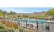 Beautiful community pool with lounge chairs and mountain views at 20718 W Colter St, Buckeye, AZ 85396