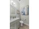 Elegant powder room features a modern mirror and vanity at 20718 W Colter St, Buckeye, AZ 85396