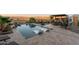 Beautiful pool with built-in loungers, a desert view, and outdoor dining nearby at 2125 Us Highway 93 --, Wickenburg, AZ 85390