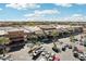 Overhead view of a shopping center featuring stores, parking, and landscaping at 2164 W Megan St, Chandler, AZ 85224