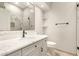 The bathroom has marble countertops, cabinets, a decorative mirror, and walk-in shower at 2164 W Megan St, Chandler, AZ 85224