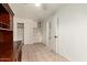 Bedroom with tile floors, closet, built-in storage, and a view into the hallway at 2164 W Megan St, Chandler, AZ 85224