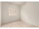 This bedroom has a window with shutters and wood-look flooring at 2164 W Megan St, Chandler, AZ 85224