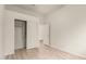 This bedroom has wood-look floors and includes a closet with sliding doors at 2164 W Megan St, Chandler, AZ 85224