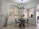 Charming dining nook with unique lighting fixture and sunlit windows enhancing the eating experience at 2164 W Megan St, Chandler, AZ 85224