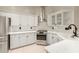 Well-lit kitchen featuring granite countertops, stainless steel appliances, and sleek cabinetry at 2164 W Megan St, Chandler, AZ 85224