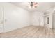 Bright living room featuring hard surface floors, white walls, and a ceiling fan at 2164 W Megan St, Chandler, AZ 85224