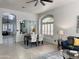 Open-concept living space featuring a dining area and living room with neutral tile floors at 2164 W Megan St, Chandler, AZ 85224