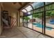 View of the pool and yard from the covered patio area with screened windows at 2164 W Megan St, Chandler, AZ 85224