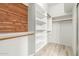 Spacious walk-in closet with wooden accents and ample shelving at 2164 W Megan St, Chandler, AZ 85224