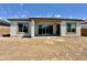 The back of the house showcases a patio with large sliding glass doors, great for indoor-outdoor living at 22685 E Saddle Way, Queen Creek, AZ 85142
