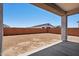 Wide view of the backyard showing the blank slate for customization with a covered patio at 22685 E Saddle Way, Queen Creek, AZ 85142