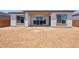 Backyard view of the home showing sliding glass doors and picture windows at 22685 E Saddle Way, Queen Creek, AZ 85142
