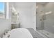 Bright bathroom with glass shower, standalone tub, designer tile floor, and a vanity sink at 22685 E Saddle Way, Queen Creek, AZ 85142