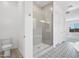 Bathroom featuring designer tile floor, frameless glass shower, and a toilet at 22685 E Saddle Way, Queen Creek, AZ 85142