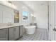 Bright bathroom with double vanity, standalone tub, designer tile floor, and a large window at 22685 E Saddle Way, Queen Creek, AZ 85142
