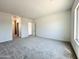 Large bedroom featuring carpet, natural light, and a neutral color palette at 22685 E Saddle Way, Queen Creek, AZ 85142