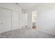 Bedroom featuring neutral carpet, closet, and bright white walls at 22685 E Saddle Way, Queen Creek, AZ 85142