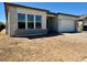 Charming single-story home with a neutral color scheme and a spacious two-car garage at 22685 E Saddle Way, Queen Creek, AZ 85142