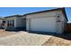 Charming single-story home with a neutral color scheme and a spacious two-car garage at 22685 E Saddle Way, Queen Creek, AZ 85142