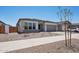 Inviting single-story home featuring desert landscaping, a neutral color palette, and a two-car garage at 22685 E Saddle Way, Queen Creek, AZ 85142