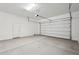 Spacious garage with automatic door, concrete floor, and ample room for storage at 22685 E Saddle Way, Queen Creek, AZ 85142