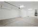 Bright garage with white walls, finished floor, and overhead lighting at 22685 E Saddle Way, Queen Creek, AZ 85142