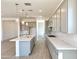 Modern kitchen featuring an expansive island, stainless steel appliances, and stylish gray cabinets at 22685 E Saddle Way, Queen Creek, AZ 85142