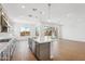 Modern kitchen with stainless steel appliances, white countertops, grey cabinets and hardwood floors at 22685 E Saddle Way, Queen Creek, AZ 85142